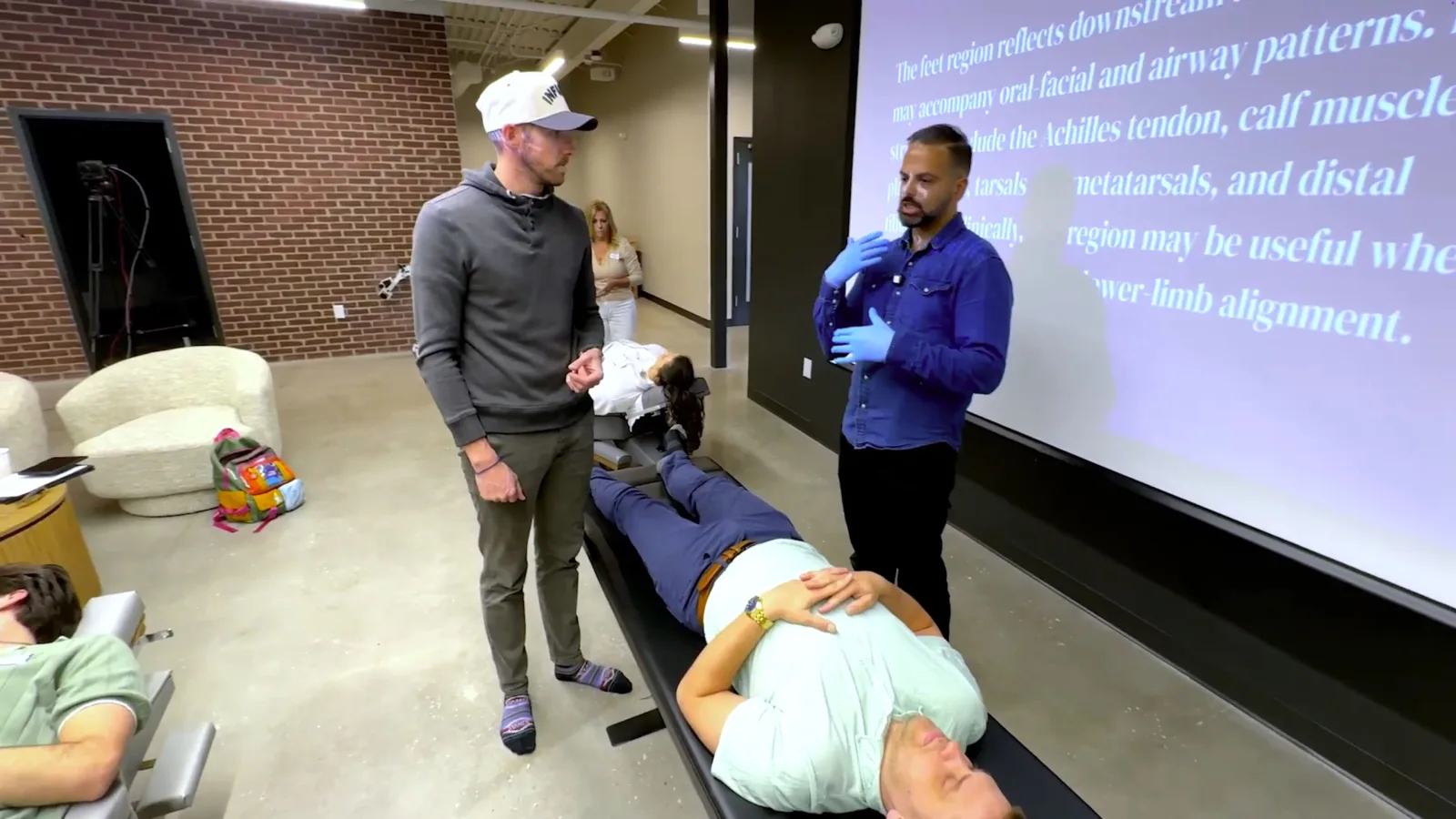 Dr. Neel Bulchandani and Dr. Josh Madsen working through the feet region during the Floor Four training