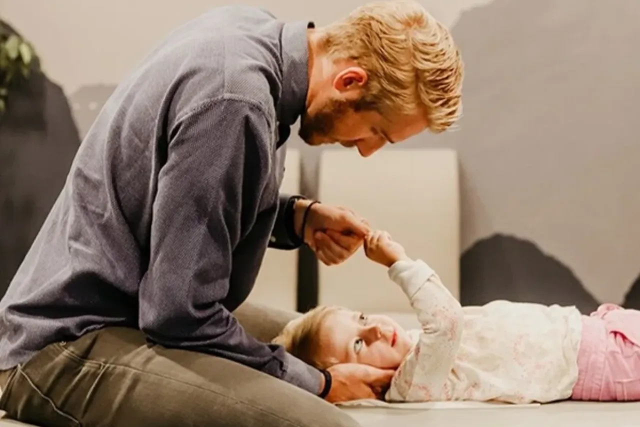 Dr. Josh Madsen connecting with a young child